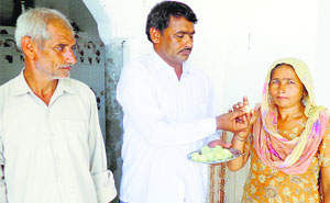 Wrestler Amit Kumars family celebrates his win at Commonwealth Games, at Nahri village in Sonepat district on Tuesday.