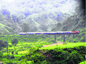 A train passes on the Pathankot-Jogindernagar railway track.