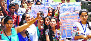 Activists of the ABVP raise slogans against fee hike and RUSA on the PG College campus in Dharamsala on Monday.