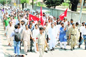 Showing solidarity: Activists of the National Conference raise slogans against Israel during a march taken out to protest the Gaza violence in Pulwama district of south Kashmir on Wednesday