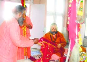 Head priest Mahant Deependra Giri performs the Chhari Sthapana ceremony at Amareshwar Temple in Srinagar on Wednesday