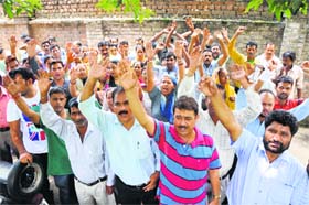 Members of the Coordination Committee of the Estates Employees Association protest in Jammu on Wednesday