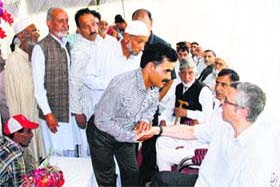 FESTIVE GREETINGS: People visit Chief Minister Omar Abdullahs Gupkar residence in Srinagar on Wednesday to extend Eid greetings