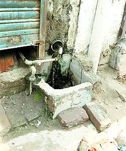 An illegal water connection detected in a colony near the 33-foot road. A tribune photograph