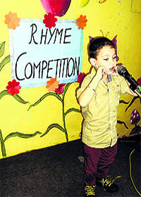 A student recites a poem during an English rhyme competition at GRD Academy;