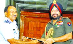 Outgoing Chief of Staffs Committee (CoSC) and Army Staff General Bikram Singh (right) hands over the CoSC baton to the Air Chief Marshall Arup Raha in New Delhi on Wednesday. A Tribune photo