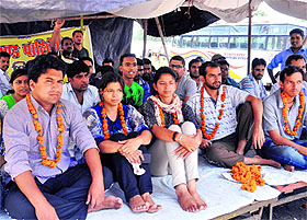 Polytechnic contractual teachers sit on a hunger strike at Parade Ground in Dehradun on Wednesday.