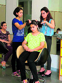 Students of Ecole Globale school participate in a beauty grooming session in Dehradun on Wednesday.
