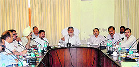 Chief Minister Harish Rawat presides over a meeting of PWD and Forest Department officials in Dehradun on Wednesday.