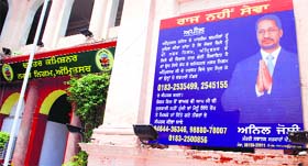 The hoarding which is the bone of contention between Mayor Bakshi Ram Arora and state minister Anil Joshi outside Town Hall Complex, in Amritsar.