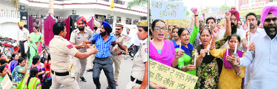 ETT teachers being forcibly taken away by police personnel to prevent them from staging a dharna outside the house of Chief Parliamentary Secretary Sarup Chand Singla; (right) members of the ETT Teachers Union take out a candle-light march demanding the release of the teachers who were detained in the morning in Bathinda on Thursday.