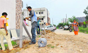 A residential colony, Vishranti, being fenced following a land dispute in Zirakpur on Thursday.