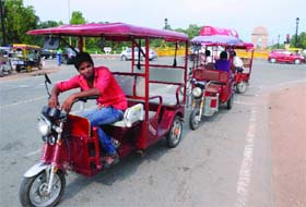 e-rickshaws parked on the road side after the High Court ban in New Delhi on Thursday