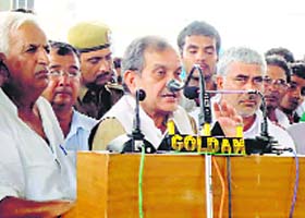 Congress leader Birender Singh addresses a meeting of supporters at Uchana in Jind district on Thursday