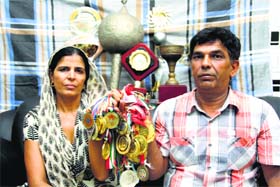 Parents of Sakshi Malik show her earlier medals at their home