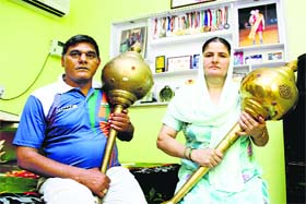 Wrestler Satyawrats mother and father Satyawan celebrate the victory of their son at their home in Rohtak on Thursday