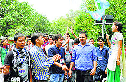 Activists of the NSUI protest the fee hike and RUSA at the PG College in Dharamsala on Thursday