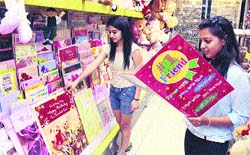 Girls look at greeting cards for Friendship Day in Jalandhar on Thursday. Photo: Sarabjit Singh