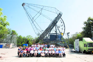 The design and implementation teams in front of the telescopes proof assembly