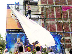 A poster being removed from a mall in Ludhiana on Thursday