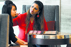 Makeup artist Ritu Kolentine gives final touches to a model at Kingfisher Ultra Fashion Show in Ludhiana