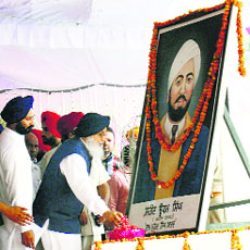 Chief Minister Parkash Singh Badal pays tributes to Shaheed Udham Singh in Sunam on Thursday.