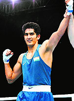 Vijender Singh celebrates after winning the match against Trinidad and Tobagos Aaron Prince in the quarterfinal