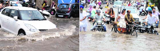 A car moves through waterlogged street; and (right) commuters wade through knee-deep water on Lawrence Road in Amritsar on Friday.