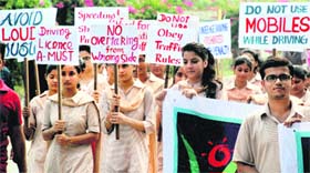 Members of the Voice of Amritsar hold a protest against traffic irregularities and mismanagement in Amritsar on Friday.