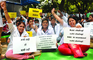Students under the banner of International Forum of Medical Graduates shouting slogans during a protest in New Delhi on Friday