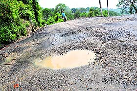 A damaged stretch of Kotwali bazar bypass road in Dharamsala.