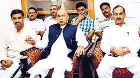 Former CM Prem Kumar Dhumal addresses mediapersons in Una on Friday.