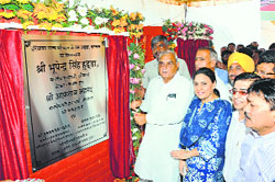 Chief Minister Bhupinder Singh Hooda lays the foundation stone of a bus stand in Karnal on Friday. 