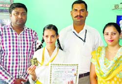 Mansi Lalotra shows the gold medal she won in the first Asian Matsogi-Do Championship held in Nepal. A Tribune photograph
