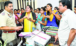 Students of the DAV College of Education speak to a policeman in the office of Principal Dr Sham Sunder Sharma (right) in Hoshiarpur on Friday