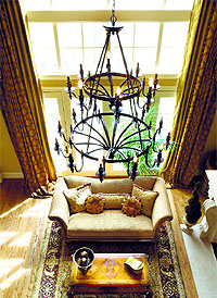 Stained glass and wrought-iron chandeliers are the ideal elements to render Gothic touch to the decor