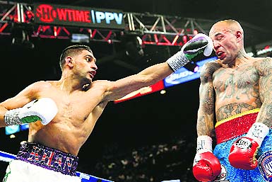 Amir Khan lands a big punch on the face of his opponent during one of his bouts