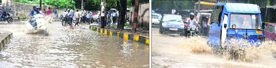 Water-logged streets after heavy rains in Dehradun on Friday.