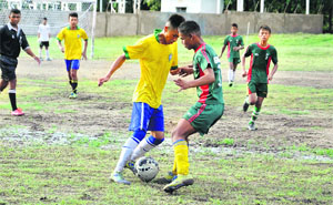 Players vie to take control of the ball during a match in the Inter School Football Championship organised by Indian Army at Mahindra Ground in Dehradun on Friday.