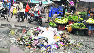 A heap of garbage at Tehsil Chowk Mandi in Dehradun on Friday.