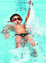 A participant in action during a swimming competition at Panjab University in Chandigarh on Saturday