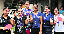Table tennis players of Sacred Heart School, Sector 26, with their coach in a jubilant mood after winning the Under-19 Inter-School Table Tennis Tournament on Saturday