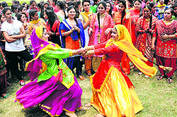 Soaking in festive fervour: Students of the Guru Gobind Singh College for Women dance during a Teej function on the college campus in Sector 26, Chandigarh, on Saturday