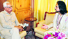 Governor NN Vohra interacts with Pandit Bhajan Sopori at Raj Bhawan in Srinagar