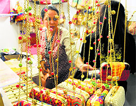 A woman tries a neckpiece