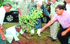 Governor Aziz Qureshi plants a sapling at Raj Bhavan in Dehradun on Saturday