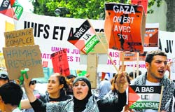 Protesters hold placards during a rally in Paris on Saturday. AFP
