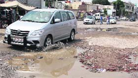 The broken stretch of a road close to the residence of Bathinda MLA Sarup Chand Singla.