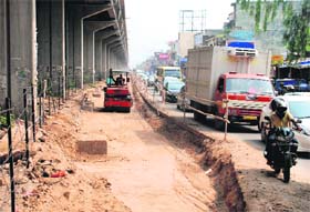 Commuters can expect respite from the daily traffic chaos as work on widening the road near shops alongside the Zirakpur flyover is on in full swing