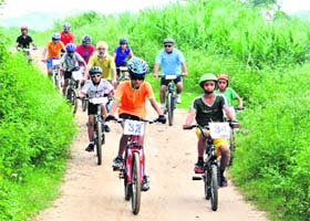 Cyclists take part in the Chandigarh Cross Country (XC) Mountain Bike Cycling Race at the forest trail behind Sukhna Lake on Sunday